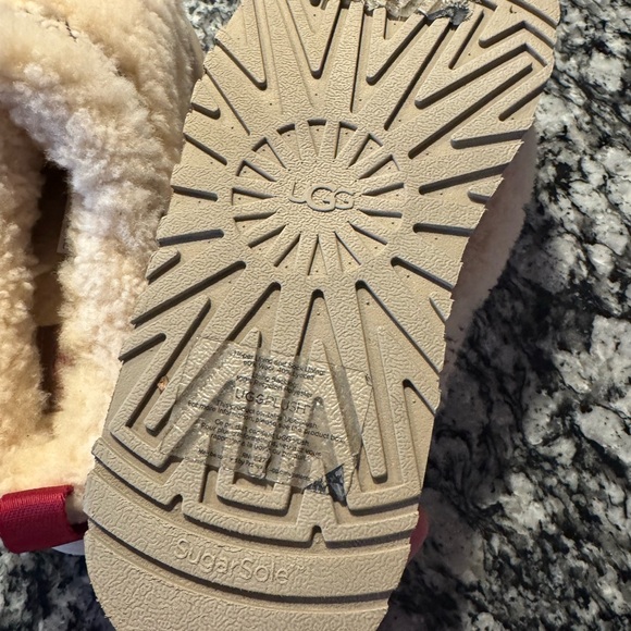 UGG Tazz Braid slippers in the "Heritage Braid Natural" colorway. - Picture 3 of 3